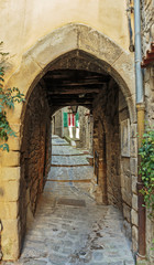 Narrow archway at the old street in the old village Lyuseram, Fr