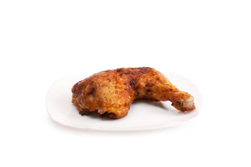 Photo baked chicken leg on a plate