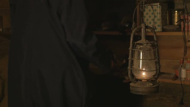 male worker puts things in order in his workshop after work , 4K
