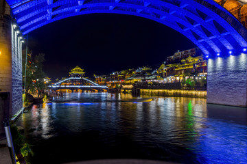 Fototapeta premium Bridge over Tuojiang river in Fenghuang at night