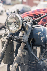 Vintage motorcycle headlight and metal toolbox
