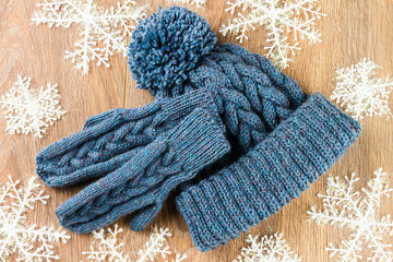 mittens, knitting cap and christmas-tree decorations