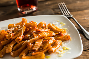 Tomato pasta on white plate
