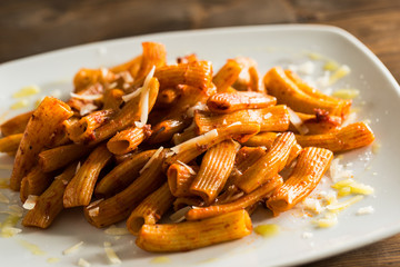 Tomato pasta on white plate
