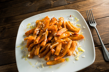 Tomato pasta on white plate