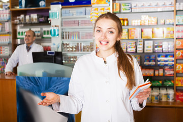 Two pharmacists in chemist shop