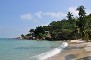 Tropical beach with houses on the island Koh Samui, Thailand