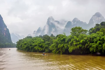 Fototapete Rund Li River with misty clouds, China © dinozzaver