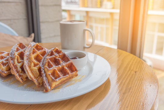 stack of waffles on wood table