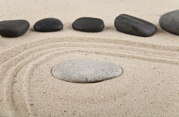 Fototapeta na wymiar background with stones and sand for meditation and relaxation to