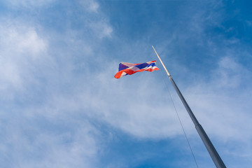 Naklejka na ściany i meble Flag of Thailand with blue sky