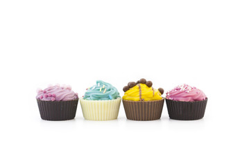 Assorted multicolored cupcakes in a row