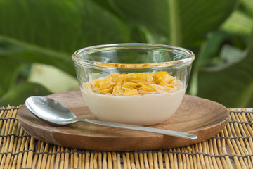 cornflakes with milk on the  cup