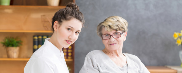 Young nurse and senior woman