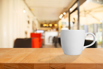A cup of coffee on table in cafe.