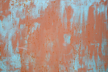 Red and blue paint marks on metal