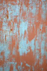 Red and blue paint marks on metal