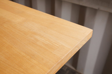 Empty wood table and blurred cafe light background.