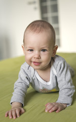 Fototapeta premium baby with mischievous smile on his face