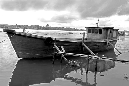 black and white image of a traditional wooden boat