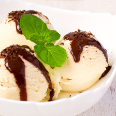  ice cream with chocolate in white bowl close-up