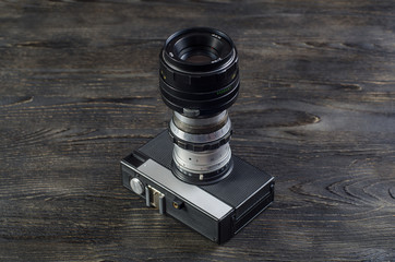 camera lenses on a wooden background