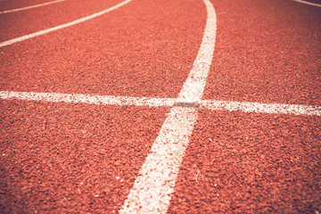 Fototapeta premium Close up line curve rubber running track standard.Vintage or retro tone.