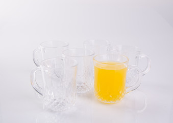 Orange juice in glasses on white background.