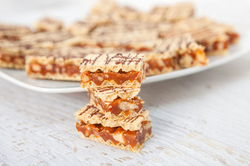 Crisp waffle wafer biscuits with caramel and walnut