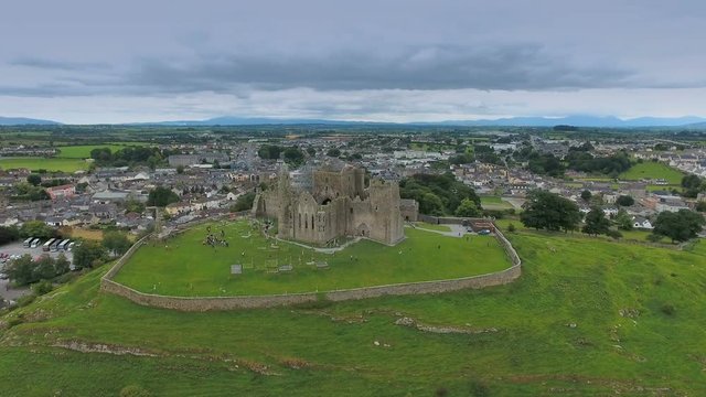 Aerial view of the Rock of Cashel in the hill with the small houses in the small town in Ireland in Ireland