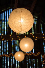 Paper lanterns in barn