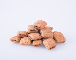 cookie or biscuits filled with chocolate cream on a background.