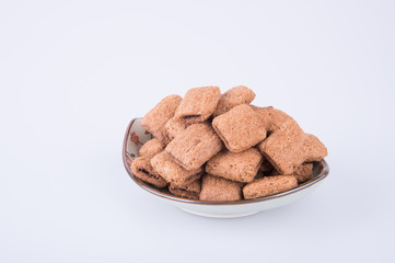 cookie or biscuits filled with chocolate cream on a background.