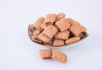 cookie or biscuits filled with chocolate cream on a background.