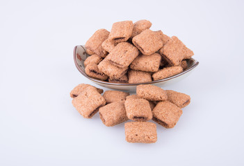 cookie or biscuits filled with chocolate cream on a background.
