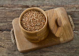 buckwheat groats on wooden surface