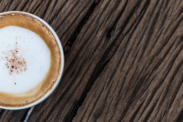 Coffee beans on wood background with space for text
