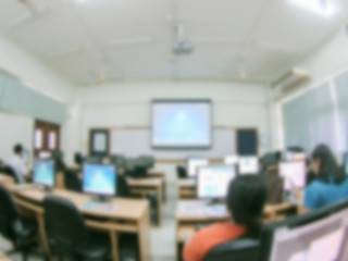 Defocused student study computer classroom for background