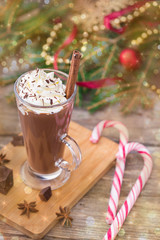 Hot chocolate with whipped cream. Christmas table.