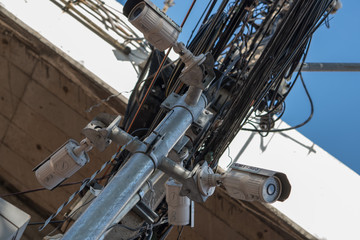 CCTV camera security and the chaos of cables and wires on every street in Bangkok, Thailand