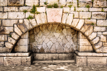 arch in the old stone wall