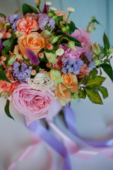 beautiful lush bouquet with roses, turquoise background, gift