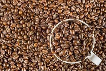 Roasted coffee bean in white cup