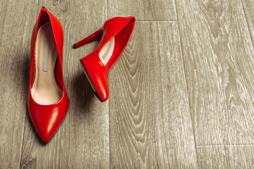 Red women shoes on wooden background