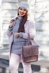 Plus size model in pink coat