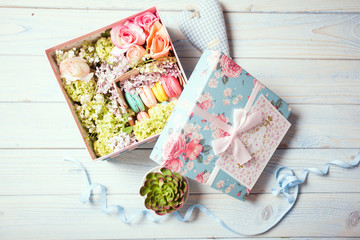 Box with flowers and macaroons