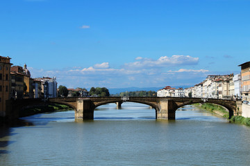 Naklejka premium Florence. Italy. Summer view of the city. Bridge Ponte Santa Trinita. Arno River.
