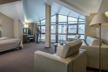 Successful businessman in luxury hotel room
