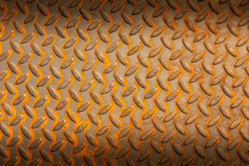 Surfaces metal floor sheet with rust.