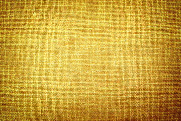 Old gold cloth texture high contrasted with vignetting effect - obrazy, fototapety, plakaty